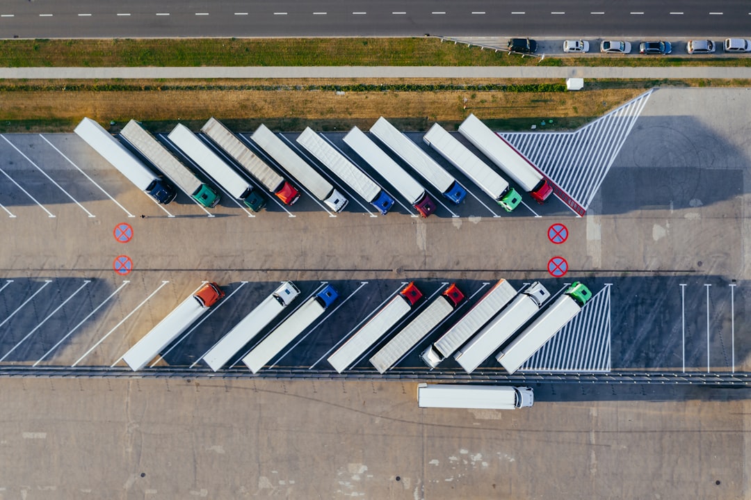 Trucks parked at a highway rest stop, aerial view